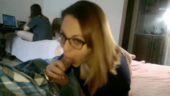 Girl gives blowjob to a guy while his girlfriend is in same room
