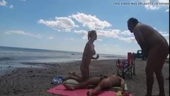 Nudist girl at the beach teasing naked men to masturbate on her
